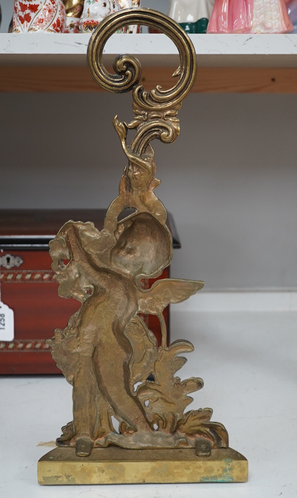 A Victorian style brass cherubic doorstop, 49cm high. Condition - some scratches to base.